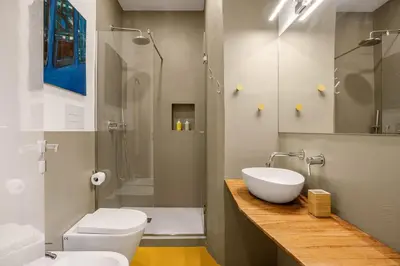 a bathroom with a sink and a toilet and a shower at Azizò, la Gialla in Palermo