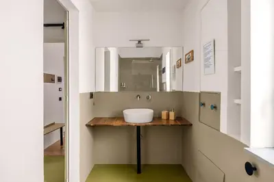 a bathroom with a sink and a mirror at Azizò, la Verde in Palermo