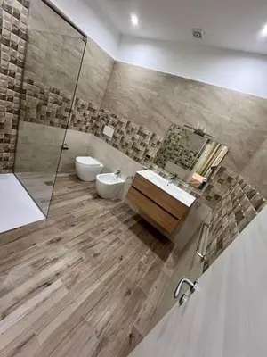 a bathroom with a shower and a toilet and a sink at Marisol in Palermo