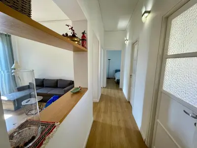 a living room with a couch and a window at Appartamento vicino il centro in Palermo
