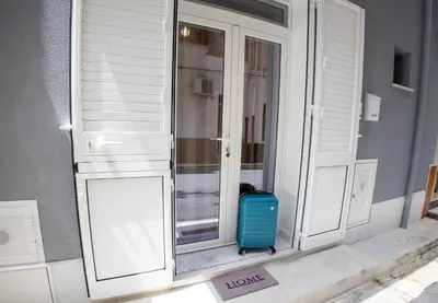a window with a suitcase sitting outside of it at Casa Grazia in Partinico