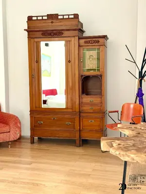 a wooden cabinet with a mirror in a room at Da Lila a Ballarò in Palermo