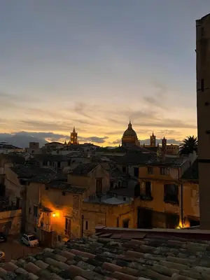 a view of a city at sunset at Le Terrazze Élite Apartment in Palermo