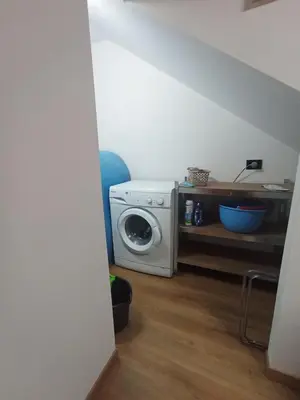 a kitchen with a washing machine in a room at B&b da Ely in Ventimiglia di Sicilia