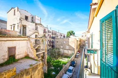 an alley in an old city with buildings at Kalsa miniLoft by Wonderful Italy in Palermo