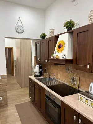 a kitchen with a sink and a counter top at Home Love in Palermo