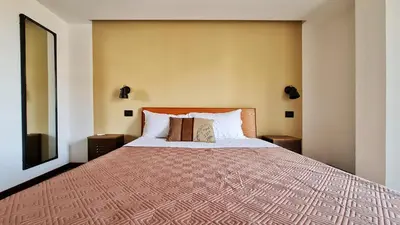 a bedroom with a large bed in a room at The blue and red rooms in Bagheria