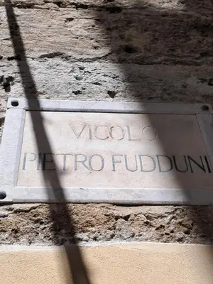 a sign on the side of a building at Pietro Fudduni Apartment in Palermo