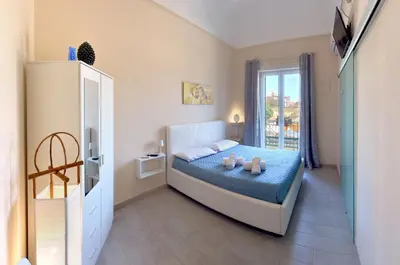 a bedroom with a bed with two teddy bears on it at Isola dei tesori - affittacamere palermo in Palermo