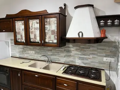a kitchen with a sink and a stove at Casa vacanze Giada in Terrasini
