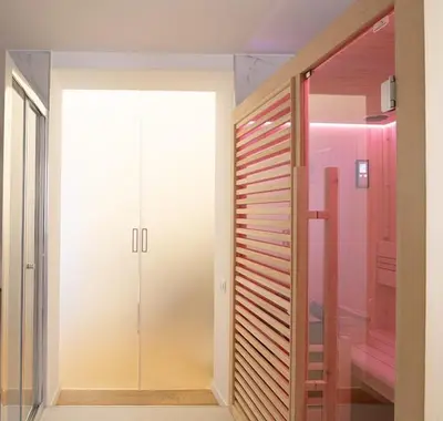 a walkin closet with a glass door in a room at FALSTAFF Rooms & Suites in Palermo