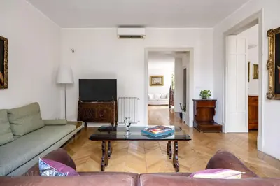 a living room with a couch and a coffee table at Elvi Penthouse by DomuSicily in Palermo