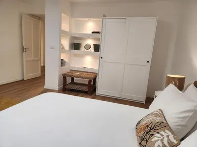 a bedroom with a bed and a white closet at La Casa Di Mitì in Palermo