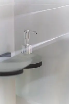 a bathroom sink with a chrome faucet at Ambrosia Suite in Palermo