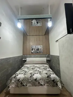 a bedroom with a bed in a room at La casetta del centro in Palermo