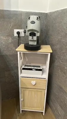 a coffee maker on top of a table at La casetta del centro in Palermo