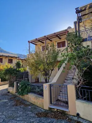 a house with a staircase in front of it at Triskelia in San Vito lo Capo