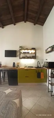 a kitchen with a sink and a counter top at Jujube hortus apartment 4 in Palermo