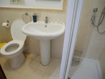 a bathroom with a sink and a toilet at Casa del pescatore Appartment -By Rentalbeb italy- in Palermo