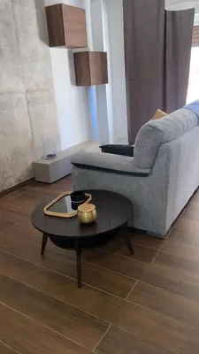 a living room with a couch and a table at Dedè Dream in Palermo