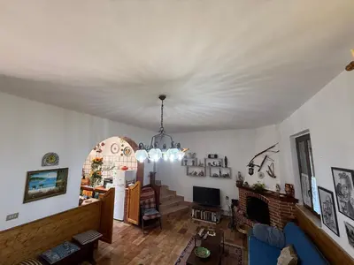 a living room with a white ceiling at Villa Shanti a Romitello - 