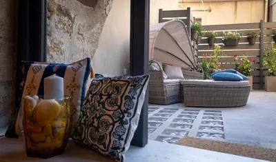 a group of pillows sitting on a patio at Boutique Apartment 