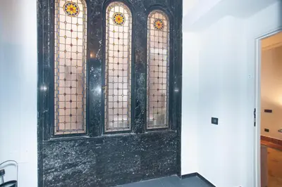 a door with stained glass windows in a room at Sella Apartment Centro Storico in Palermo