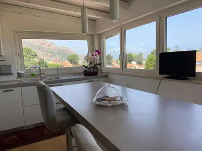 a kitchen with a table with a bowl of food on it at marinellahomeandsea in Palermo