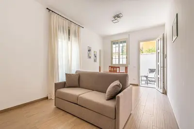 a living room with a couch and a window at La Casetta Donna Vita a Mondello by Wonderful Italy in Palermo