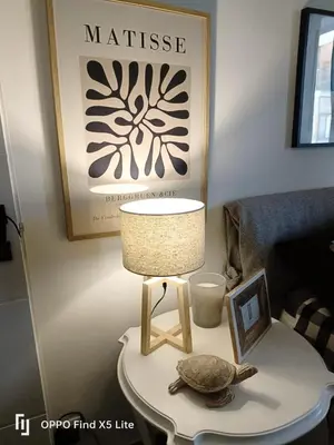 a table with a lamp and a turtle on it at Suite 374 in Palermo