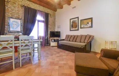 a living room with a couch and a table at Nice Home In Partinico With Wifi in Partinico