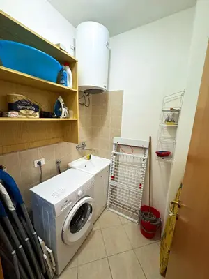 a laundry room with a washing machine and a sink at Appartamento Trinacria in Castellammare del Golfo