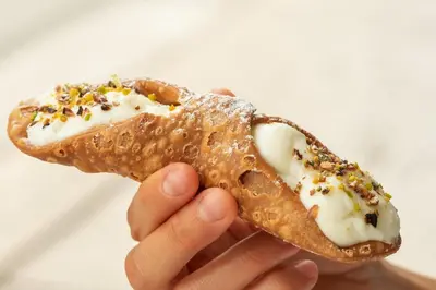 a person is holding a half eaten banana at Alloggio delle Carrozze al Ballarò in Palermo