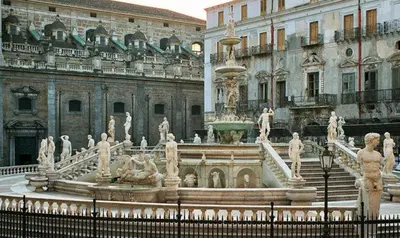 a large fountain in front of a building at Alloggio delle Carrozze al Ballarò in Palermo
