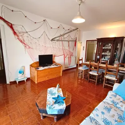 a living room with a couch and a table at La Terrazza su Mondello in Palermo