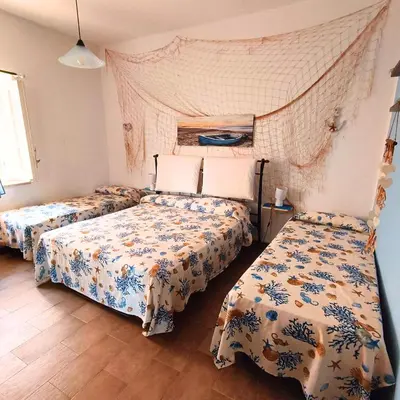 a bedroom with two beds in a room at La Terrazza su Mondello in Palermo