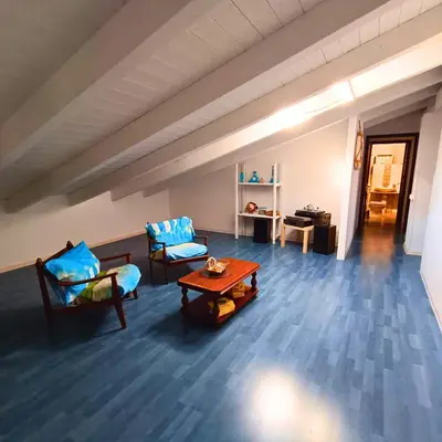 a living room with two chairs and a table at La Terrazza su Mondello in Palermo