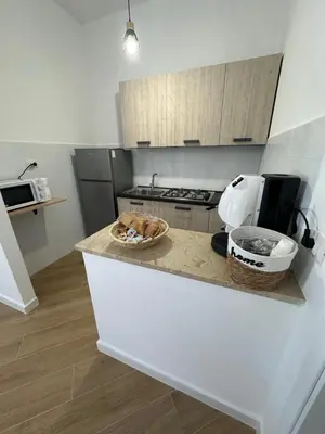a small house with an orange and white at casa consiglio ardicula in Terrasini