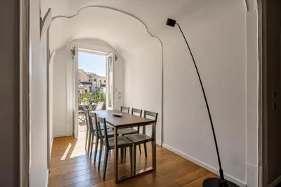 a dining room with a table and chairs at Maruisa suite apartment in Palermo