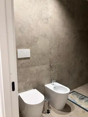 a bathroom with a toilet and a sink at B&B Sulle Vie del Capo in Palermo