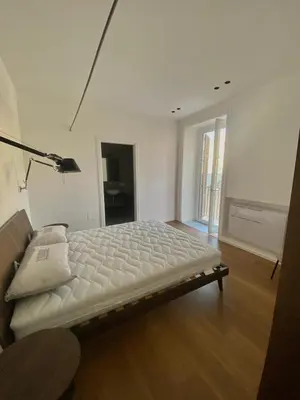 a bedroom with a bed with a mirror at B&B Sulle Vie del Capo in Palermo