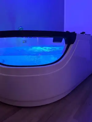 a large tank of blue water in a room at Lacasadelrelax in Monreale