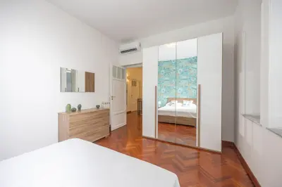 a bedroom with a bed and a large mirror at Aria di sale in Palermo