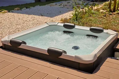 a hot tub sitting on top of a wooden deck at Dimora Masi di GN Real Escapes in Castellammare del Golfo