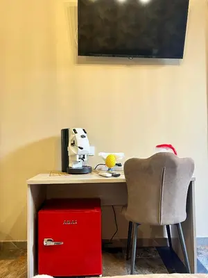 a desk with a chair and a computer on it at B&B Dimora Emily in Palermo