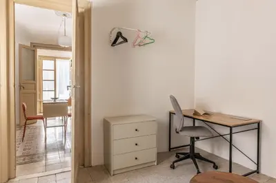 a desk and a chair in a room at Casa Beatrice con Terrazza by Wonderful Italy in Palermo