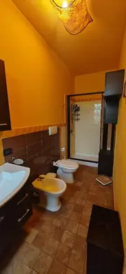 a bathroom with two toilets and a shower at Villa Samay Luxury House in Carini