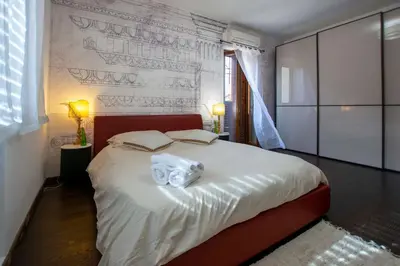a bedroom with a bed with a towel on it at Central Panoramic View in Palermo