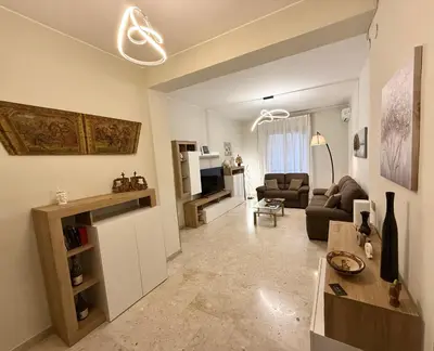 a living room with a couch and a table at Dantes House in Palermo