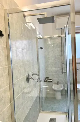 a bathroom with a shower and a sink at Dantes House in Palermo